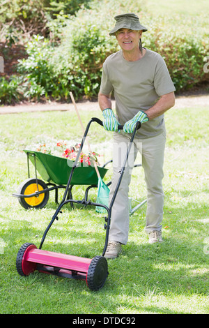 Man mowing lawn Stock Photo - Alamy
