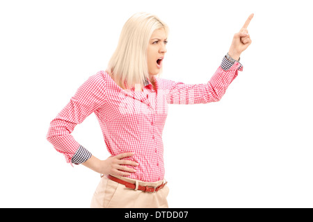 Violent young woman shouting and pointing with finger Stock Photo