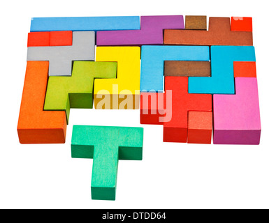 multicoloured puzzle blocks and T-shaped piece isolated on white background Stock Photo