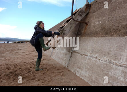 Exmouth beach, post storm damage, trying to use the now higher beach steps, Devon, Britain, UK Stock Photo