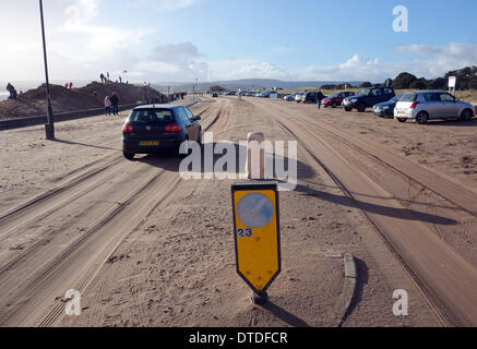 Exmouth beach, post-storm damage, cars drive on the sand covered road, Devon, Britain, UK Stock Photo