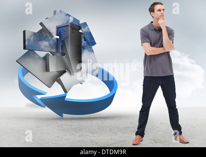 Composite image of thoughtful standing man and his legs apart Stock Photo