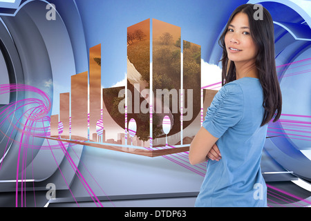 Composite image of smiling asian woman with arms crossed looking over her shoulder Stock Photo