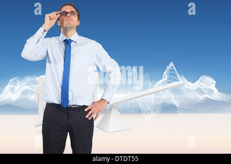 Composite image of thinking businessman tilting glasses Stock Photo