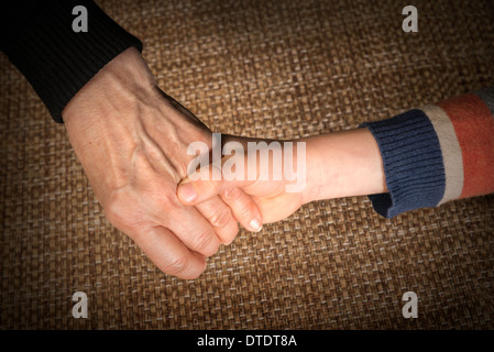 Two hands caught. Adult and child hand Stock Photo
