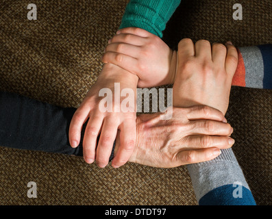 Many hands together. Interior shot Stock Photo