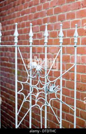A spider web on metal railings awaits the built-in light Stock Photo ...