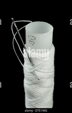 needle and thread isolated on a white background