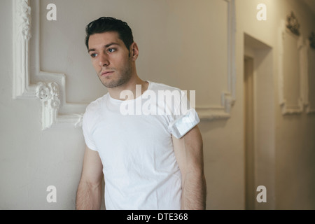 Part of series showing different ways one carries a smartphone, folded in t-shirt sleeve as older generation carried cigarettes Stock Photo