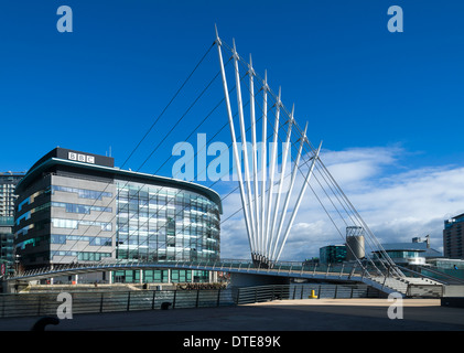 Quay House and the new footbridge (2010) over the Manchester Ship Canal at MediaCityUK, Salford Quays, Manchester, England, UK Stock Photo