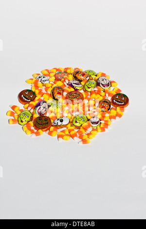 Halloween candy corn sweets colorful trick or treat nobody from above overhead isolated cutout cut out white on backgroud table nobody vertical hi-res Stock Photo