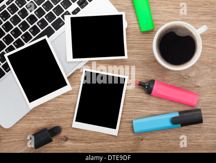 Blank instant photo frames over office table. View from above Stock Photo