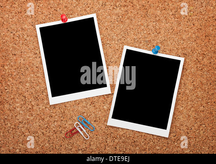 Blank instant photo frames on cork wooden background Stock Photo