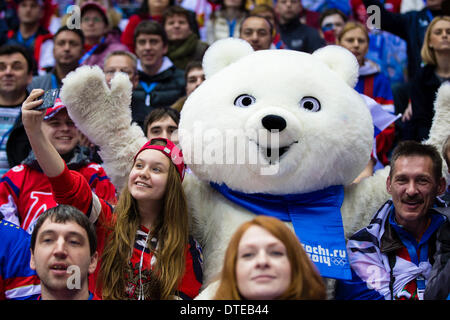 Sochi, Krasnodar Krai, Russia. 16th Feb, 2014. A young fan takes her picture with one of the mascots during the Men's Ice Hockey Premilinary Round Group A match between Russia and Slovakia at the Bolshoy Ice Dome, Coastal Cluster - XXII Olympic Winter Games Credit:  Action Plus Sports/Alamy Live News Stock Photo