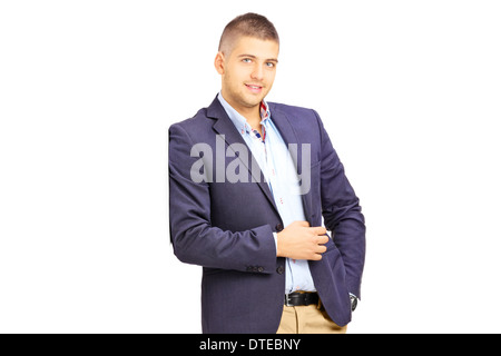 Young fashionable man leaning against a wall Stock Photo