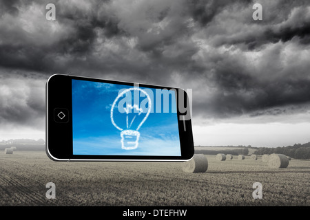 Composite image of cloud light bulb on smartphone screen Stock Photo