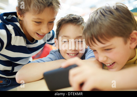 Boys using a new smartphone Stock Photo