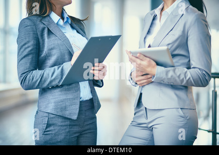 Close-up of two businesswomen interacting at meeting Stock Photo