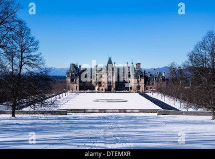 The Biltmore Mansion, front View, with snow on the ground and mountains in the background, Asheville North Carolina Stock Photo