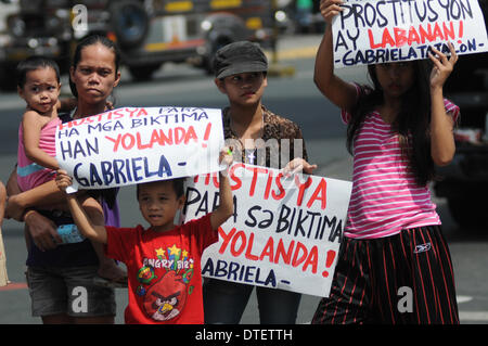 Manila, Philippines. 17th Feb, 2014. MANILA, Philippines - 100 days after the super-typhoon Haiyan (locally known as Yolanda) hit Central Visayas, an alliance of survivors of the typhoon called ''People Surge'' and other groups stormed the Malacanang Presidential Palace in Manila on 17 February 2014. The protesters said that the Aquino government is facing the mounting anger of the people of Eastern Visayas over its failure to lift them from their misery. Credit:  George Calvelo/NurPhoto/ZUMAPRESS.com/Alamy Live News Stock Photo