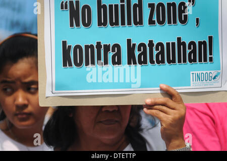 Manila, Philippines. 17th Feb, 2014. MANILA, Philippines - 100 days after the super-typhoon Haiyan (locally known as Yolanda) hit Central Visayas, an alliance of survivors of the typhoon called ''People Surge'' and other groups stormed the Malacanang Presidential Palace in Manila on 17 February 2014. The protesters said that the Aquino government is facing the mounting anger of the people of Eastern Visayas over its failure to lift them from their misery. Credit:  George Calvelo/NurPhoto/ZUMAPRESS.com/Alamy Live News Stock Photo