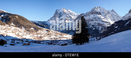 Panoramic view with the town of Grindelwald and surrounding mountains in the Bernese Alps, Switzerland. Stock Photo