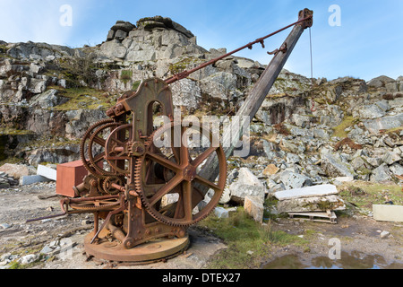 Rustly old winch crane used in a stone quarry Stock Photo