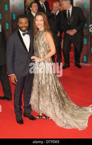London, UK, 16/02/2014 : Red Carpet Arrivals at the EE British Academy Film Awards. Persons Pictured: Chiwetel Ejiofor, Sari Mercer. Picture by Julie Edwards Stock Photo