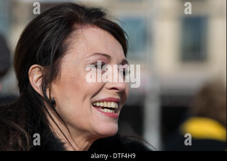 Berlin, Germany. 17th Feb, 2014. German actress Iris Berben arrives for the laying of QR paving stones at the Holocaust Memorial in Berlin, Germany, 17 February 2014. Visitors can scan a Quick Response code from the cobbles to listen to a specially developed Holocaust Memorial concert. Photo: INGA KJER/dpa/Alamy Live News Stock Photo