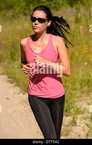 Athlete woman running training on sunny day with sunglasses Stock Photo