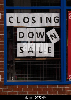 Closing down sale sign in a shop window Stock Photo