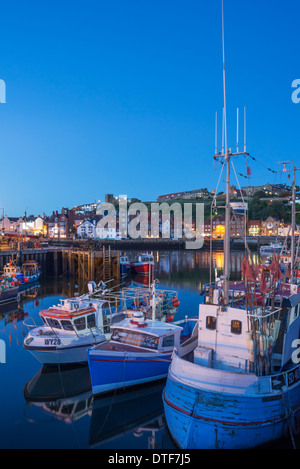 Fishing and pleasure boats in Whitby harbour, looking towards the south side of the town, Yorkshire, England Stock Photo