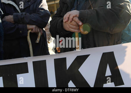 Athens, Greece. 17th Feb, 2014. Doctors, who have been on strike for more than two months, protested outside EOPYY(National Organisation for Healthcare Provision) offices in Athens against the government decision to close EOPYY clinics for a month pending the launch of a new primary healthcare system. The reforms are part of cost-cutting and efficiency-boosting measures Greece is implementing in exchange for the international rescue loans that have kept the country afloat since 2010. Credit:  Aristidis Vafeiadakis/ZUMAPRESS.com/Alamy Live News Stock Photo