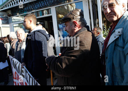 Athens, Greece. 17th Feb, 2014. Doctors, who have been on strike for more than two months, protested outside EOPYY(National Organisation for Healthcare Provision) offices in Athens against the government decision to close EOPYY clinics for a month pending the launch of a new primary healthcare system. The reforms are part of cost-cutting and efficiency-boosting measures Greece is implementing in exchange for the international rescue loans that have kept the country afloat since 2010. Credit:  Aristidis Vafeiadakis/ZUMAPRESS.com/Alamy Live News Stock Photo