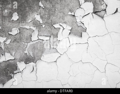 Texture of old white cracked paint on concrete wall