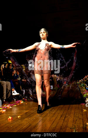 London, UK. 15th Feb 2014. Katrina Darling (who is distantly related to Catherine, Duchess of Cambridge) had a dress sewn to her skin at fashion show by Sorapol, fittingly held at Royal College of surgeons. Credit:  Rachel Megawhat/Alamy Live News Stock Photo
