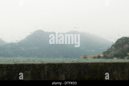 Landscape through wet glass, Lake Como, Italy Stock Photo