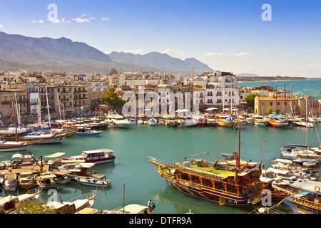 Scenic view of a busy historic harbour and the old town in Kyrenia (Girne) on the Island of Cyprus. Stock Photo