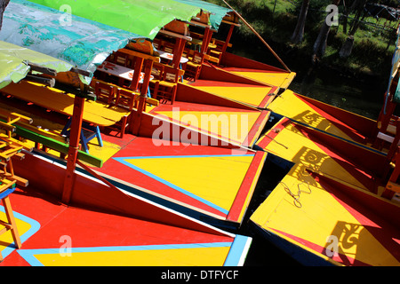 Colourful trajineras (flat.bottomed boats) on the canals of Xochimilco, Mexico City Stock Photo