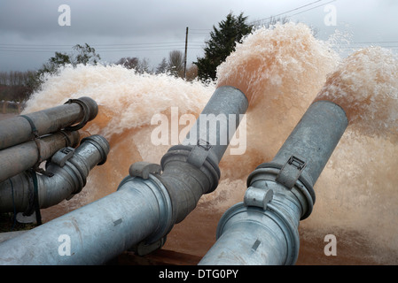 Pumping water from the flooded Somerset levels using emergency pumps installed at Burrowbridge Somerset Stock Photo