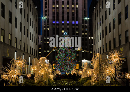 Early evening at Rockefeller Center with the bright and colorful Christmas tree and holiday decorations. Stock Photo