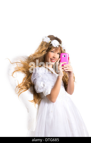 Angel blond girl taking picture mobile smartphone and feather wings on white byod to heaven Stock Photo