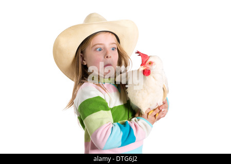 Funny kid girl expression surprised gesture scared about hen on white background Stock Photo