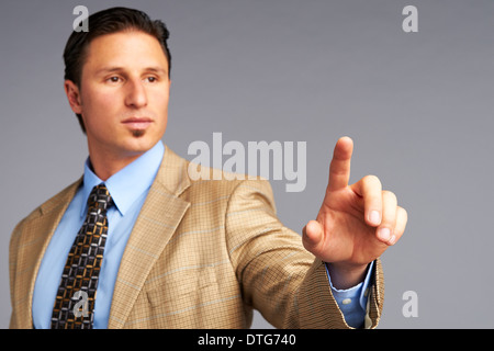 Businessman touching digital screen Stock Photo