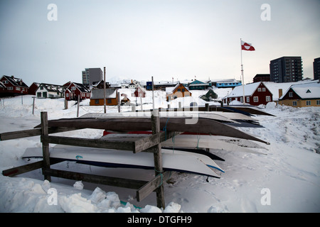 Kayaks on a shore in Nuuk. Greenland Stock Photo