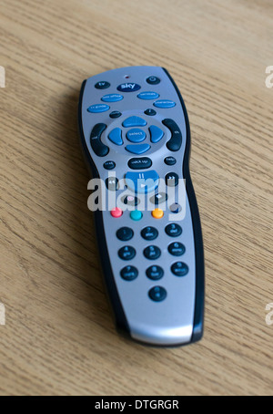 A Sky television remote control is pictured on a table at home. Stock Photo