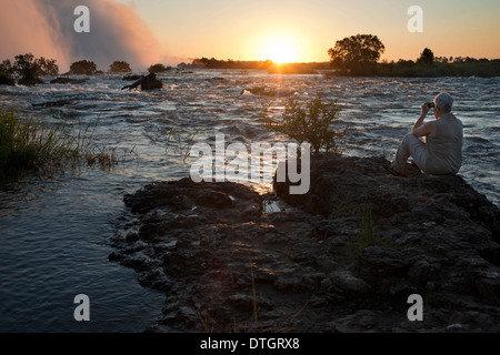 Sunset in the Victoria Falls. The Largest Waterfall in the World. The Victoria Falls have been billed as the Greatest Falling Stock Photo