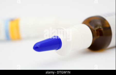 Lying nasal spray on a grey background. Stock Photo