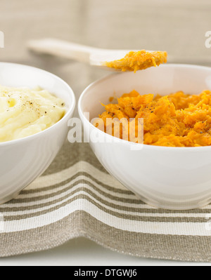 Bowl of mashed potatoes and of mashed butternut squash Stock Photo