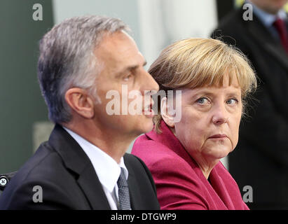 Berlin, Germany. 18th Feb, 2014. Swiss President and Foreign Minister Didier Burkhalter and German Chancellor Angela Merkel (CDU) hold a press conference after their meeting in Berlin, Germany, 18 February 2014. Photo: WOLFGANG KUMM/DPA/Alamy Live News Stock Photo